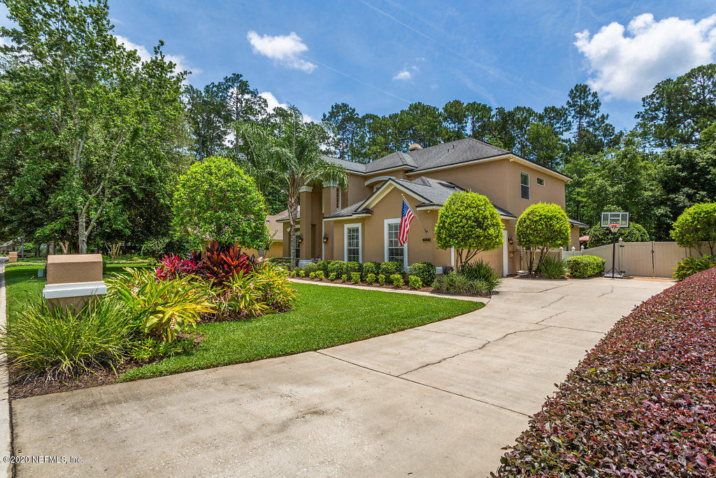 3824 Reds Gait Lane Jacksonville, FL 32223 - Photo 65 of 68 a front view of a house with garden