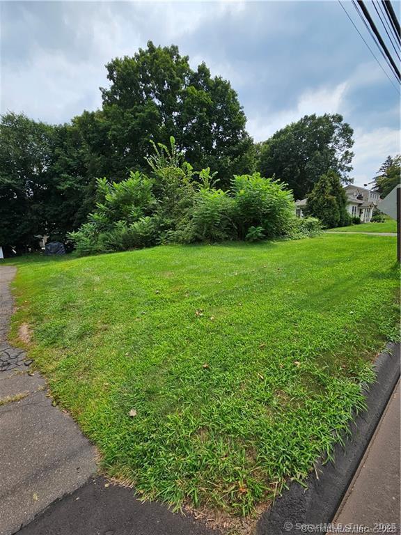 a view of field with trees in the background
