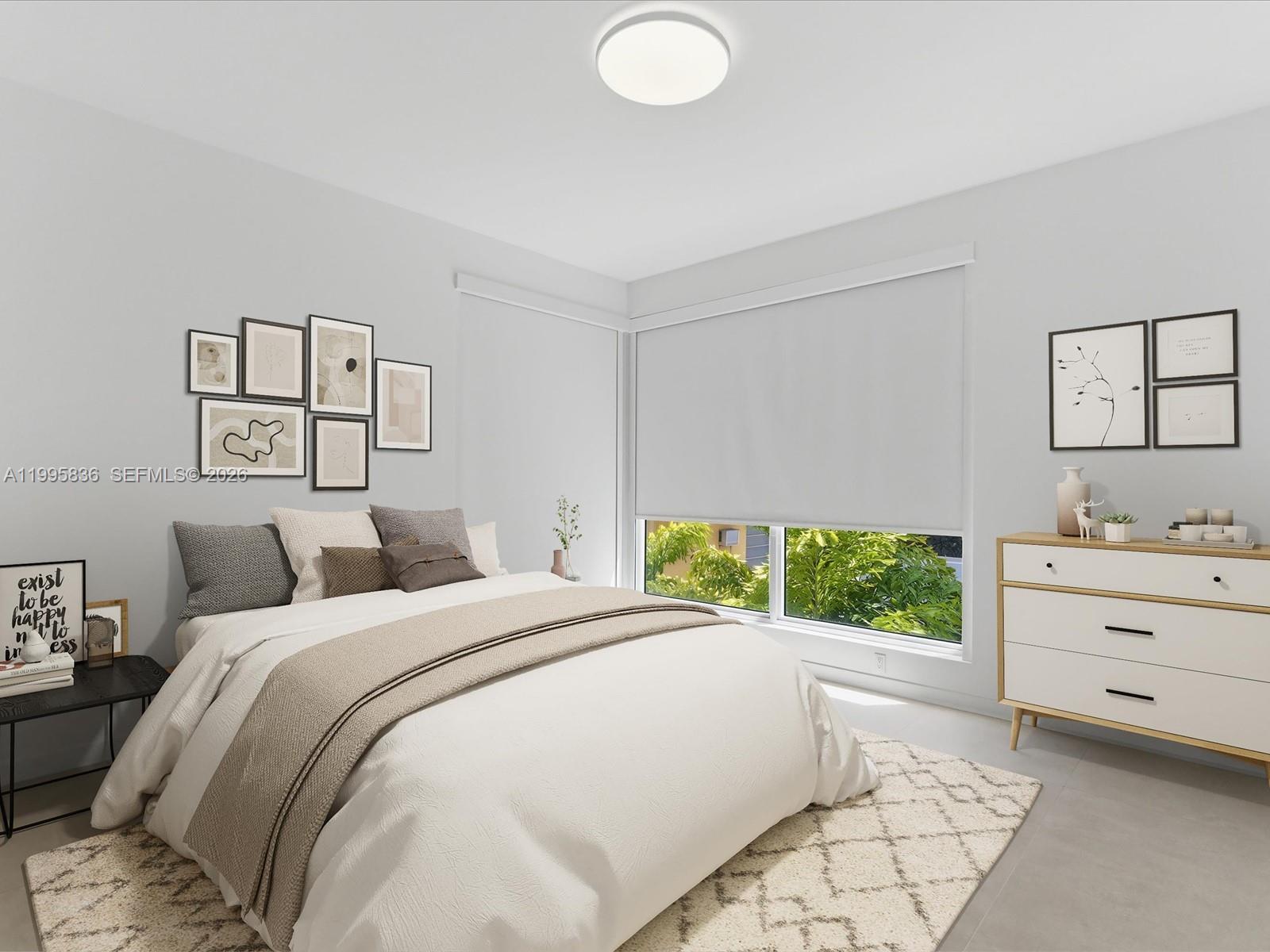 529 Southwest 11th Street, Unit 303 Miami, FL 33129 - Photo 11 of 35 a spacious bedroom with a bed and a window