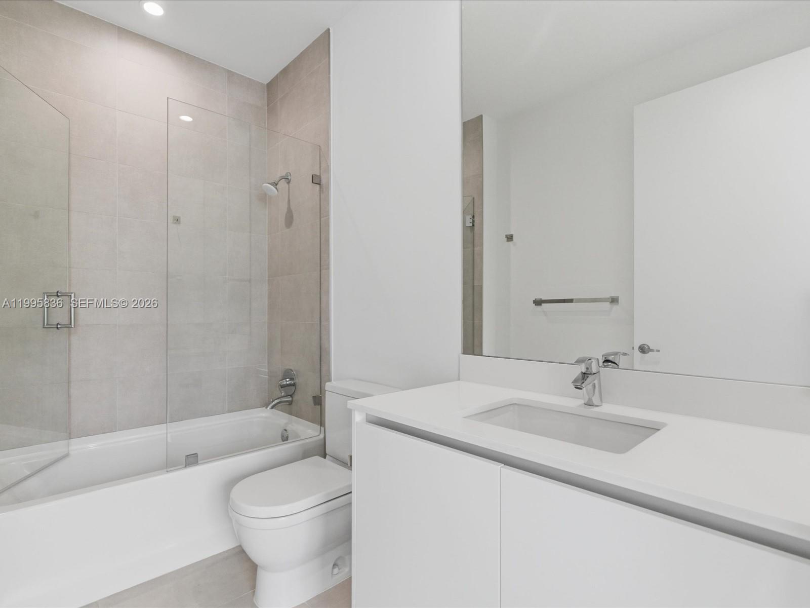 529 Southwest 11th Street, Unit 303 Miami, FL 33129 - Photo 13 of 35 a bathroom with a sink a toilet and bathtub