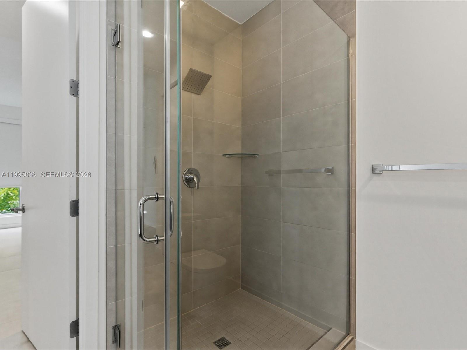 529 Southwest 11th Street, Unit 303 Miami, FL 33129 - Photo 20 of 35 a bathroom with a shower
