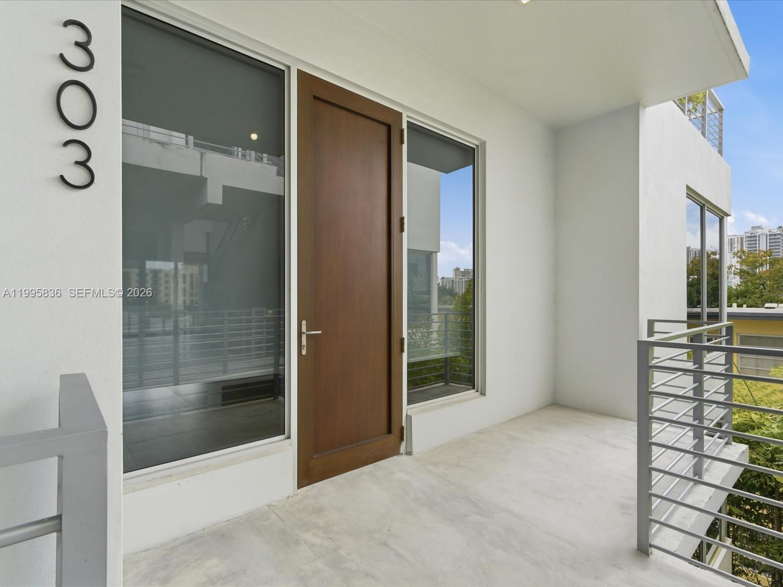 529 Southwest 11th Street, Unit 303 Miami, FL 33129 - Photo 2 of 35 a bathroom with a shower and a sink