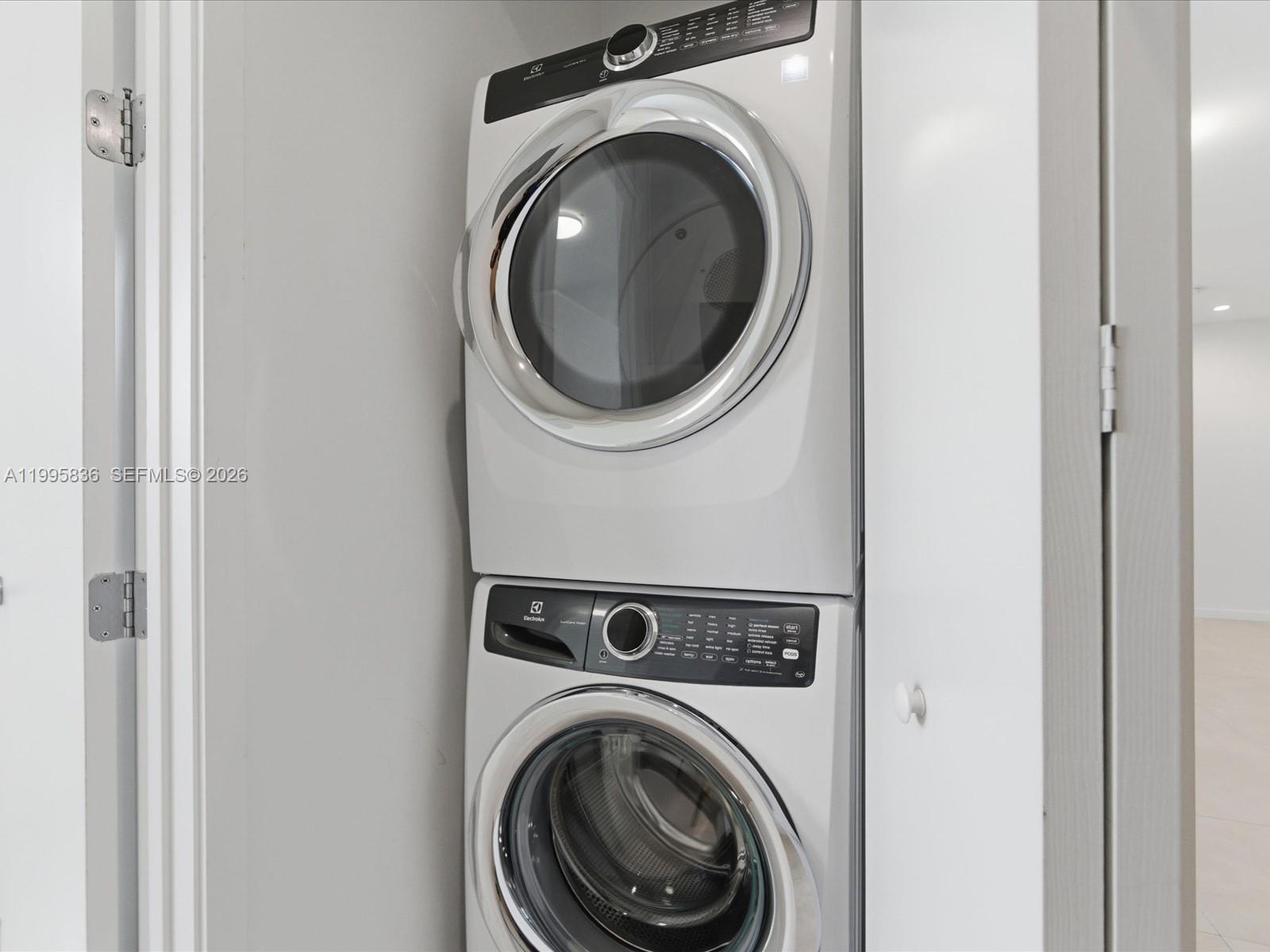 529 Southwest 11th Street, Unit 303 Miami, FL 33129 - Photo 23 of 35 a utility room with dryer and washer