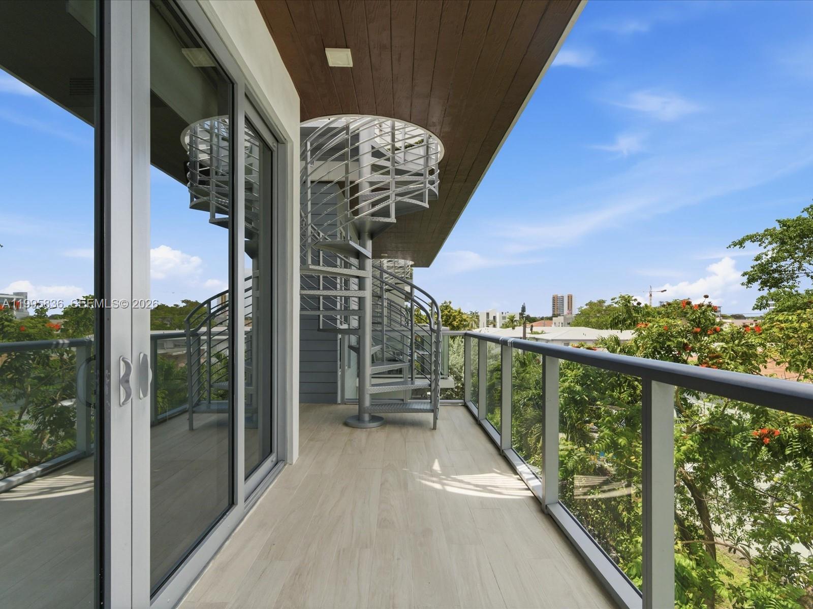 529 Southwest 11th Street, Unit 303 Miami, FL 33129 - Photo 25 of 35 a view of balcony with furniture