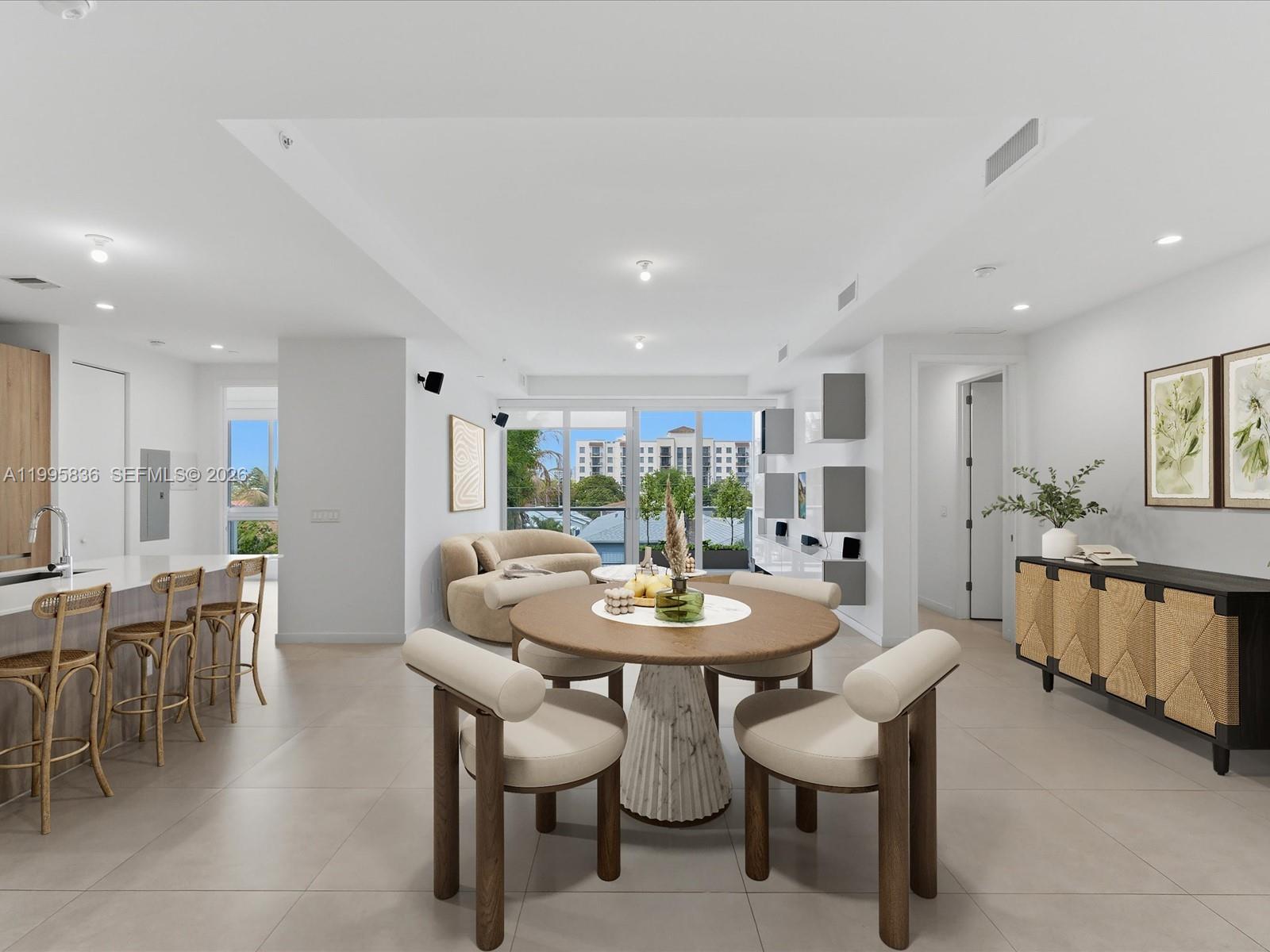 529 Southwest 11th Street, Unit 303 Miami, FL 33129 - Photo 3 of 35 a view of a dining room with furniture