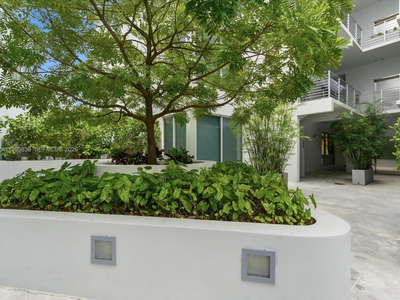 529 Southwest 11th Street, Unit 303 Miami, FL 33129 - Photo 35 of 35 front view of a house with a yard