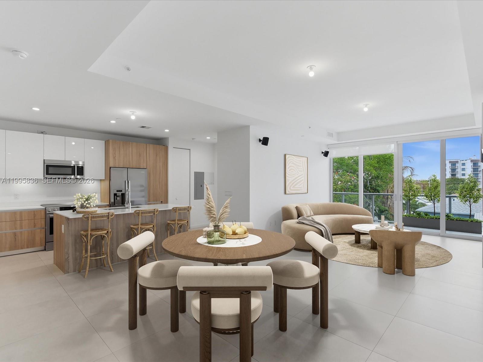 529 Southwest 11th Street, Unit 303 Miami, FL 33129 - Photo 5 of 35 a view of a dining room with furniture a couch and wooden floor