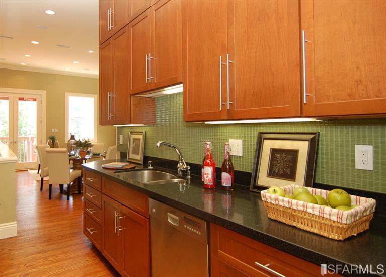 3973 Cesar Chavez San Francisco, CA 94131 - Photo 15 of 46 Up to date modern kitchen with custom cherry cabinetry, 6 burner commercial style stove, under counter lighting, French door refrigerator and granite counters.
