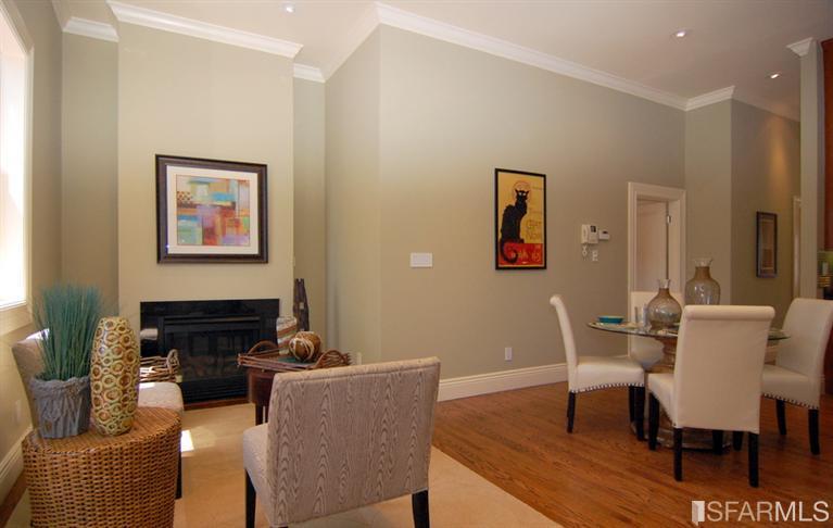 3973 Cesar Chavez San Francisco, CA 94131 - Photo 16 of 46 Welcoming great room with bright southern exposure features a warm gas fireplace, hardwood floors and opens on to the deck and garden below.