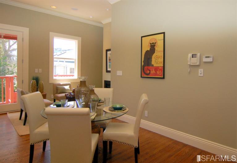 3973 Cesar Chavez San Francisco, CA 94131 - Photo 17 of 46 Welcoming great room with bright southern exposure features a warm gas fireplace, hardwood floors and opens on to the deck and garden below.