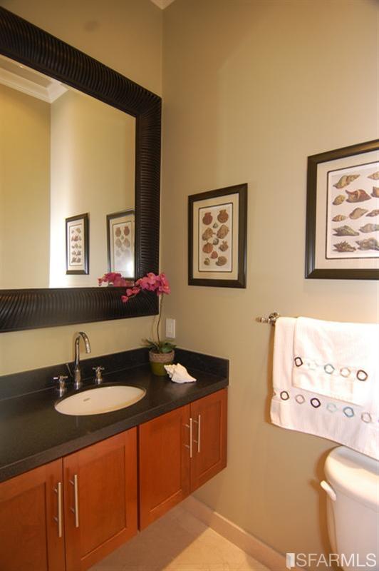 3973 Cesar Chavez San Francisco, CA 94131 - Photo 21 of 46 Main level half bath with custom cabinetry and granite counters.