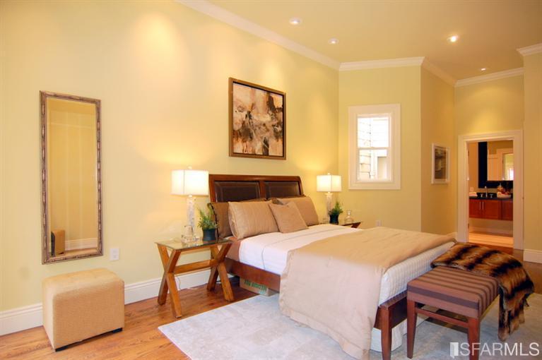 3973 Cesar Chavez San Francisco, CA 94131 - Photo 30 of 46 The lower level master suite with French doors out to the "Spa" hot tub, patio and garden features soaring 11' ceilings, hardwood floors, custom lighting, two generous closets with custom built-ins and a "spa-like" bath with rain shower.