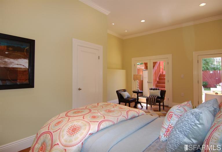 3973 Cesar Chavez San Francisco, CA 94131 - Photo 35 of 46 Last of 4 bedrooms features two sets of French doors that lead out to the patio and garden, beautiful hardwood floors, 11'ft ceilings and a large closet with custom built-ins. This is a large space that can be used in so many ways...a bedroom, guest retreat, occasional room