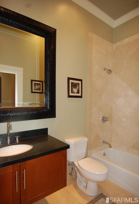 3973 Cesar Chavez San Francisco, CA 94131 - Photo 37 of 46 Main full bath on the lower level features; shower over tub, custom cabinetry, granite counters and custom in-laid tile.