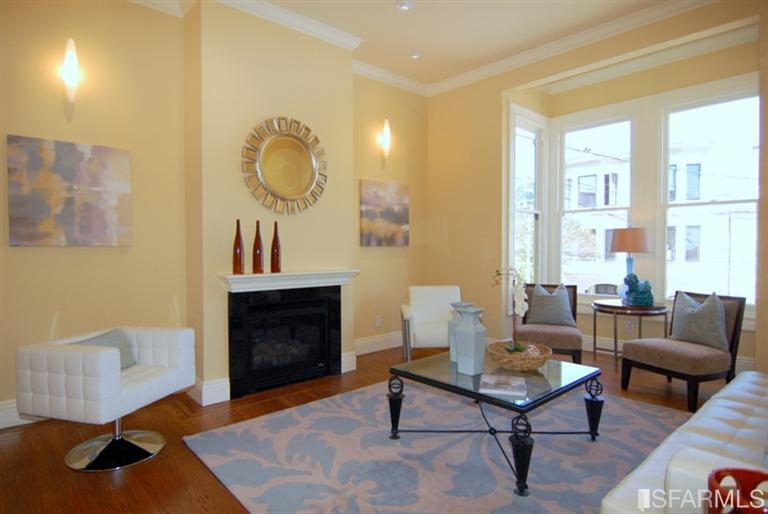 3973 Cesar Chavez San Francisco, CA 94131 - Photo 7 of 46 A beautiful bright living room with gas fireplace and a bay window that still has original glass panes giving you that wonderful "wavy" view of the world.