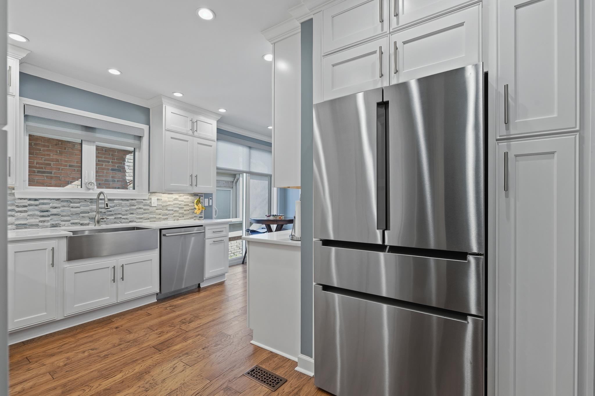 4050 Baronne Way, Unit 34 Memphis, TN 38117 - Photo 12 of 32 a kitchen with stainless steel appliances granite countertop a refrigerator sink and white cabinets