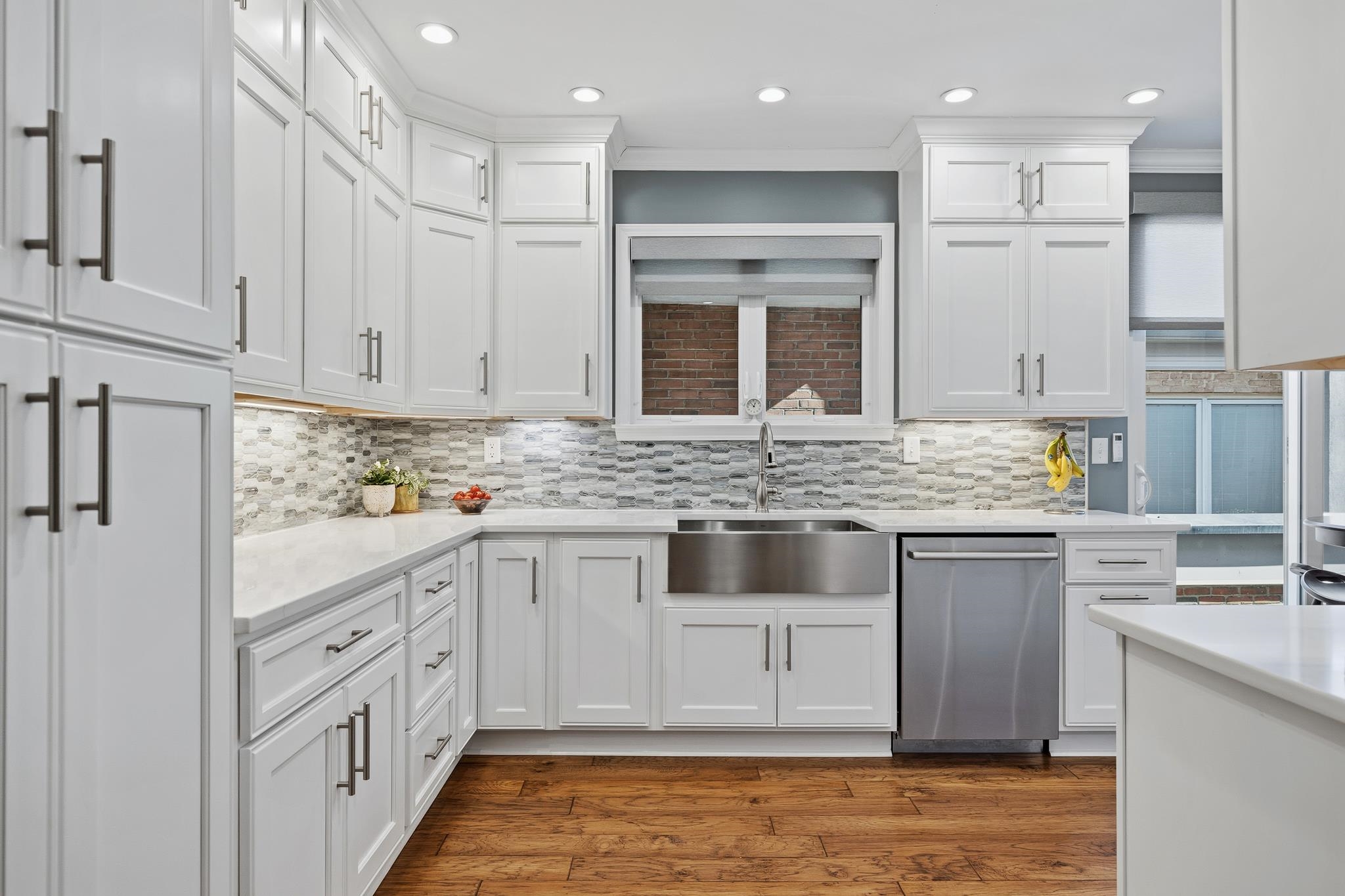 4050 Baronne Way, Unit 34 Memphis, TN 38117 - Photo 13 of 32 a kitchen with white cabinets and sink