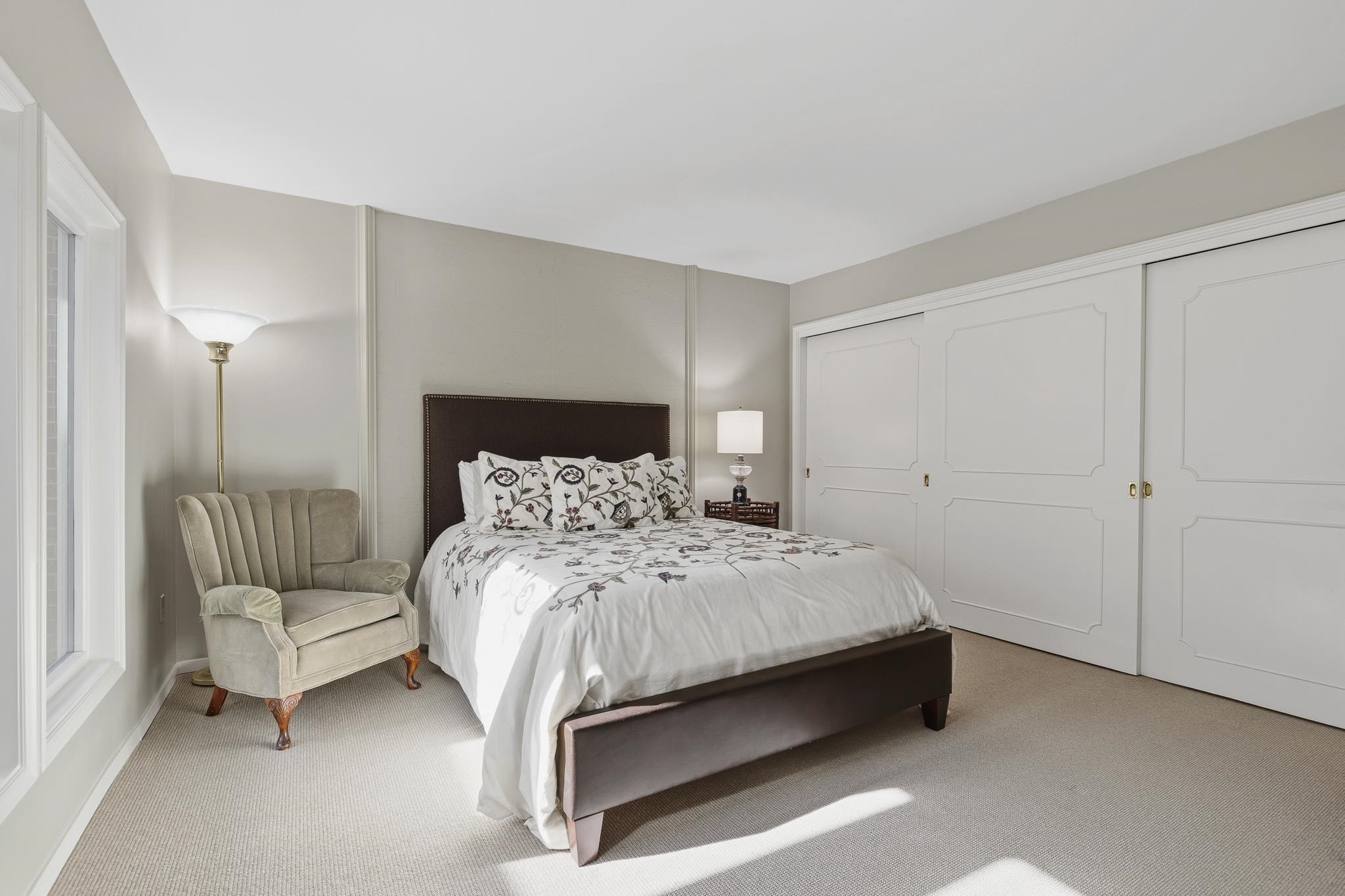 4050 Baronne Way, Unit 34 Memphis, TN 38117 - Photo 26 of 32 a bedroom with a bed and a chair