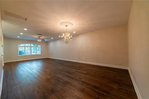 a view of living room with granite countertop furniture and fireplace
