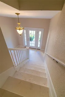 a balcony with trees in front of it