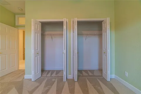 a view of a storage & utility room with a washing machine