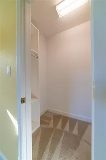 an aerial view of a house with outdoor space and swimming pool