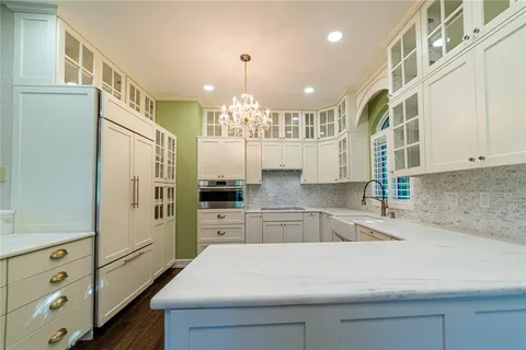 a kitchen with a sink and cabinets