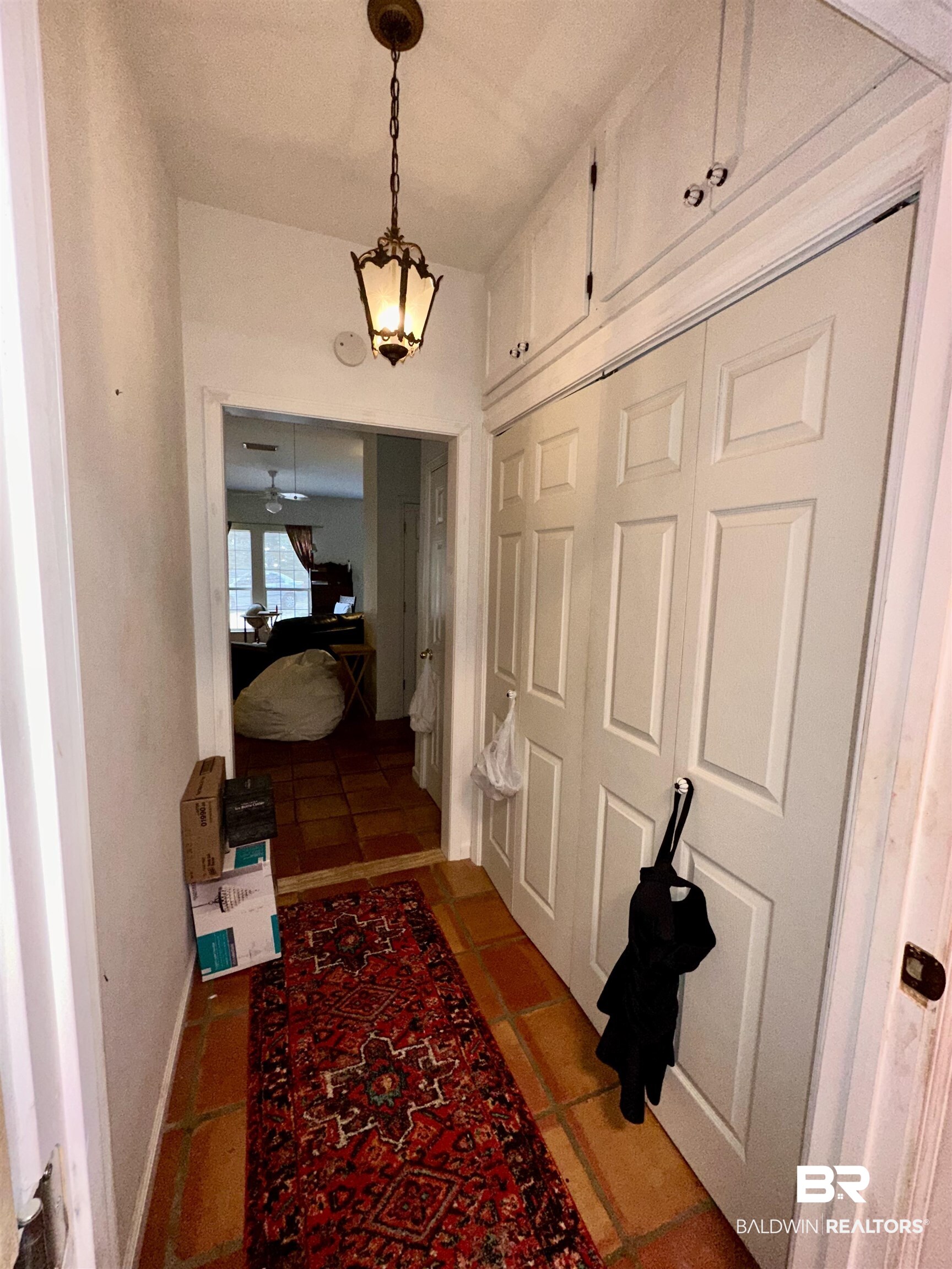 9101 Coronada Road Elberta, AL 36530 - Photo 11 of 27 Hallway featuring tile patterned floors and baseboards