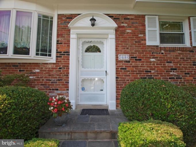 1001 Loxford Terrace Silver Spring, MD 20901 - Photo 3 of 25 a front view of a house with a garden