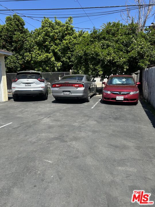 14757 Sylvan Street Van Nuys, CA 91411 - Photo 5 of 6 a view of a cars parked in a parking lot