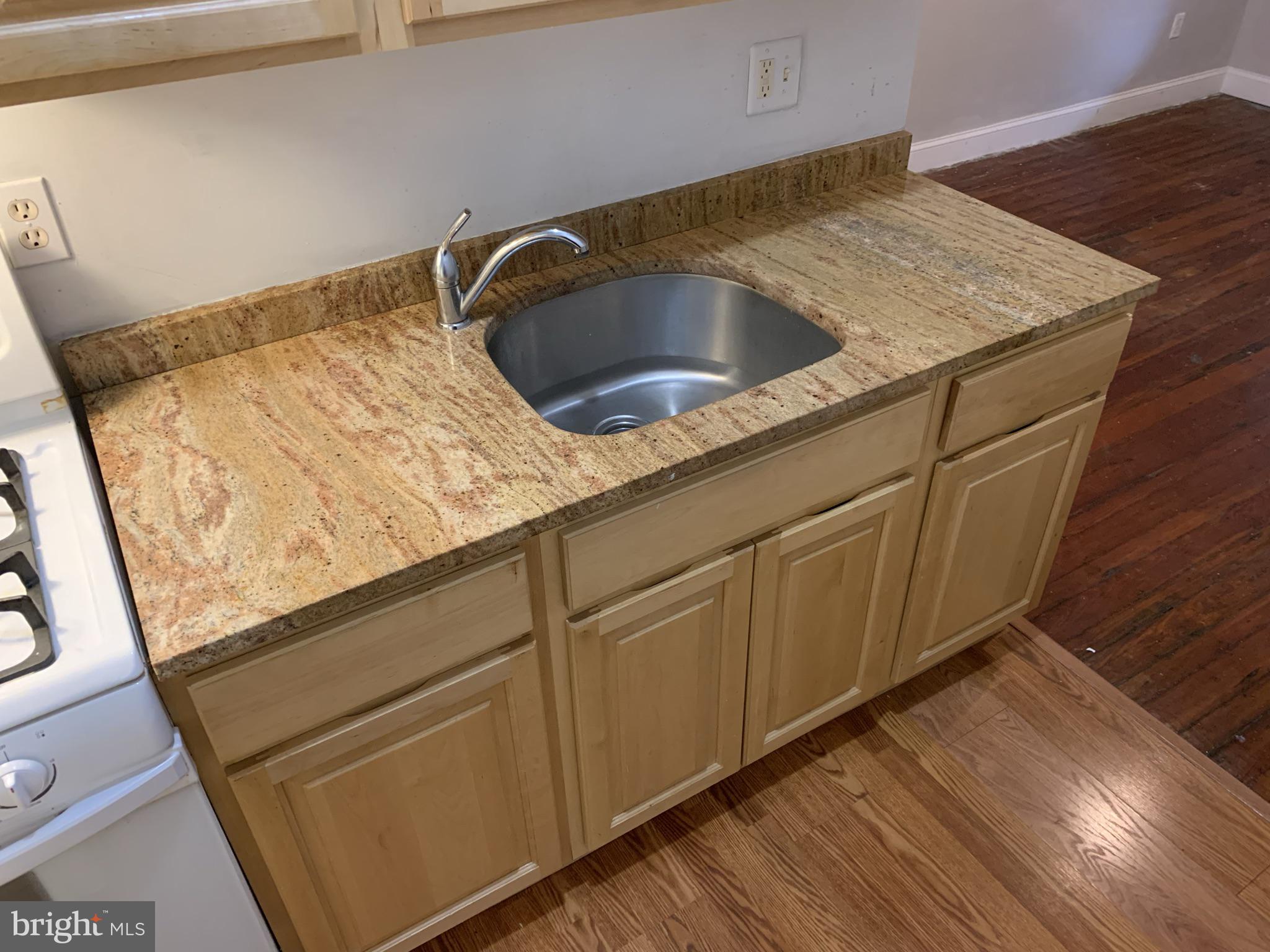 4437 Chestnut Street, Unit 1F Philadelphia, PA 19104 - Photo 10 of 15 a close view of sink and tap