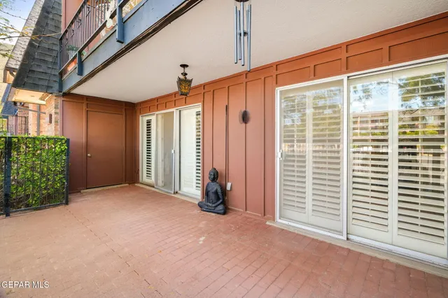 a view of a room with wooden walls and a window