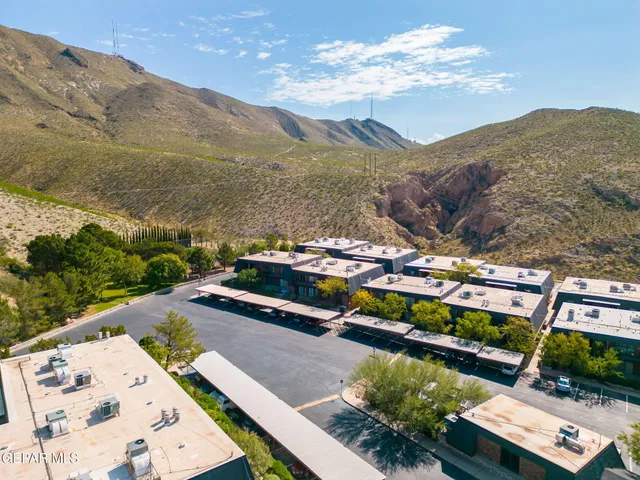 a view of a city with mountains in the background