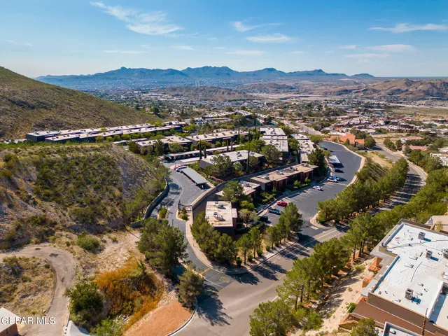 a view of a city with mountains in the background