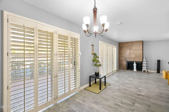 a view of a livingroom with furniture and windows