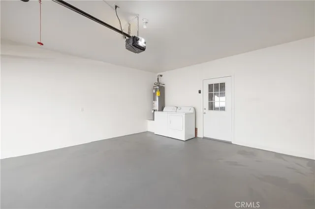 a view of a street with potted plants