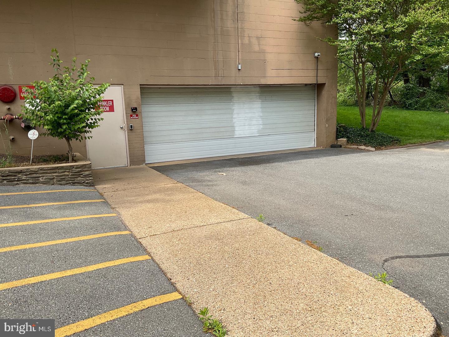 575 Thayer Avenue, Unit 404 Silver Spring, MD 20910 - Photo 19 of 26 a house with potted plants in front of door