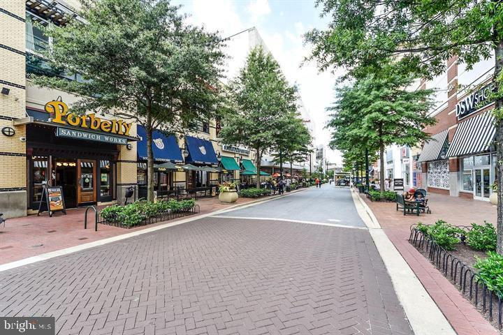 575 Thayer Avenue, Unit 404 Silver Spring, MD 20910 - Photo 26 of 26 a city street lined with buildings and trees