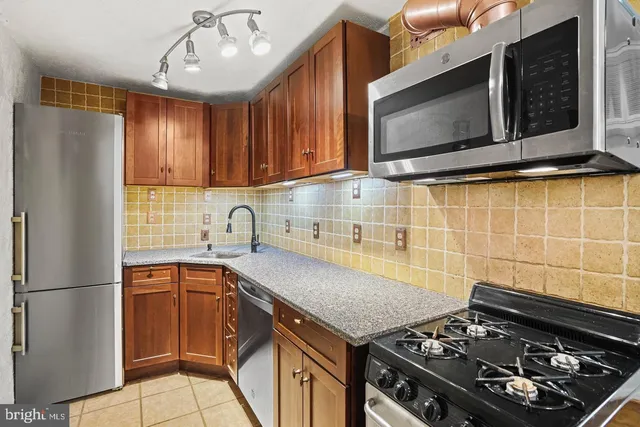 a kitchen with a stove and a microwave