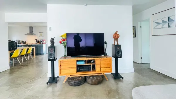 a living room with furniture and a flat screen tv