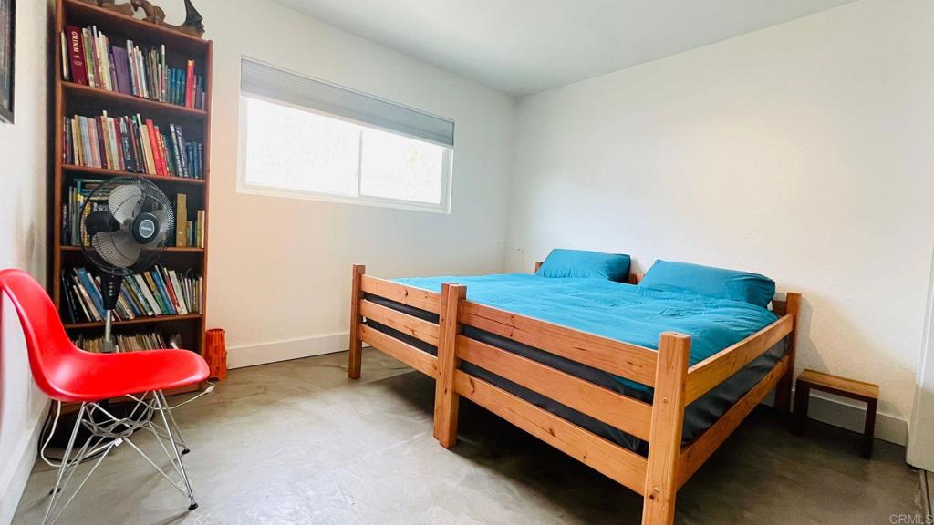 3834 La Rosa Drive San Marcos, CA 92078 - Photo 13 of 20 a blue bed sitting in a bedroom next to a book shelf