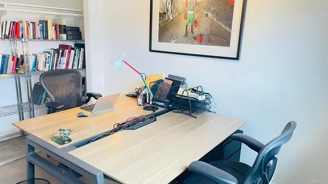 a view of a workspace with furniture