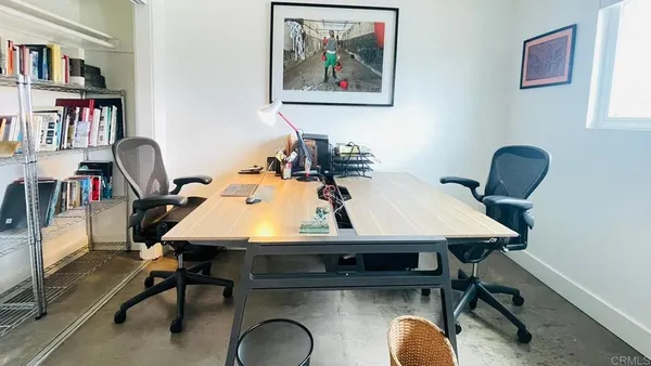 a view of a workspace with furniture