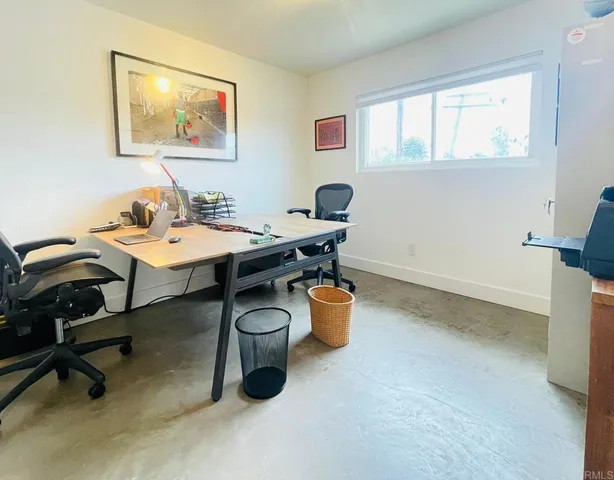 a workspace with furniture and window