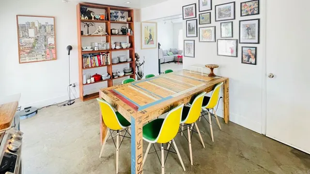 a room that has a table and chairs in it