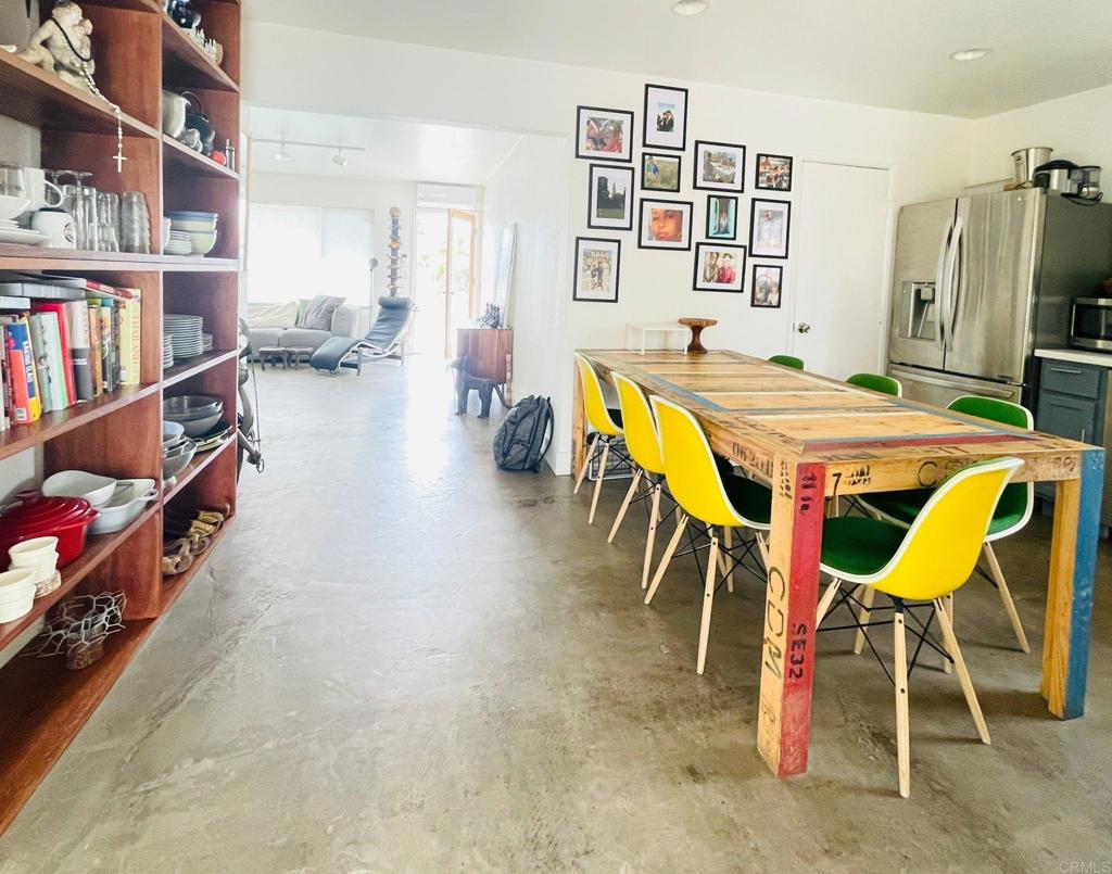 3834 La Rosa Drive San Marcos, CA 92078 - Photo 5 of 20 a dining room with furniture and a book shelf