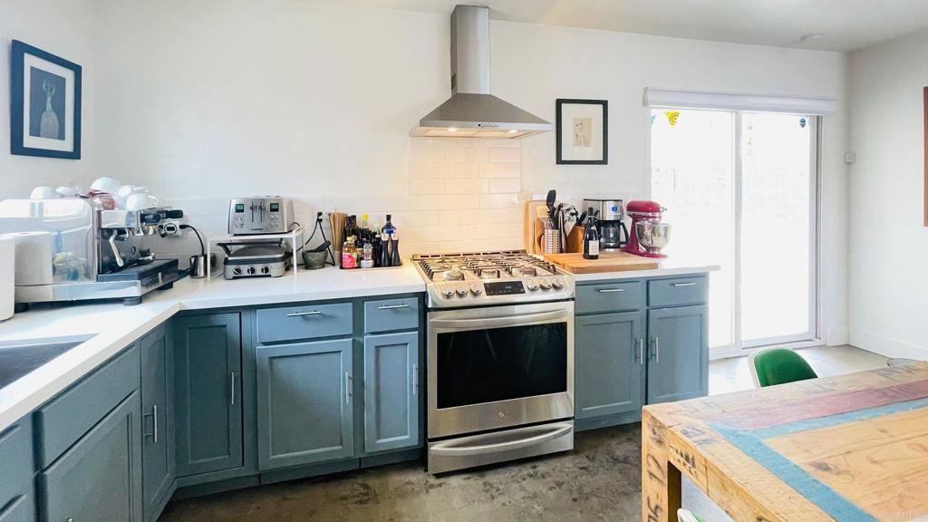 3834 La Rosa Drive San Marcos, CA 92078 - Photo 6 of 20 a kitchen with stainless steel appliances granite countertop a sink stove and cabinets