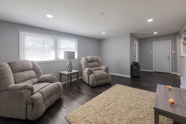 a living room with furniture and a couch
