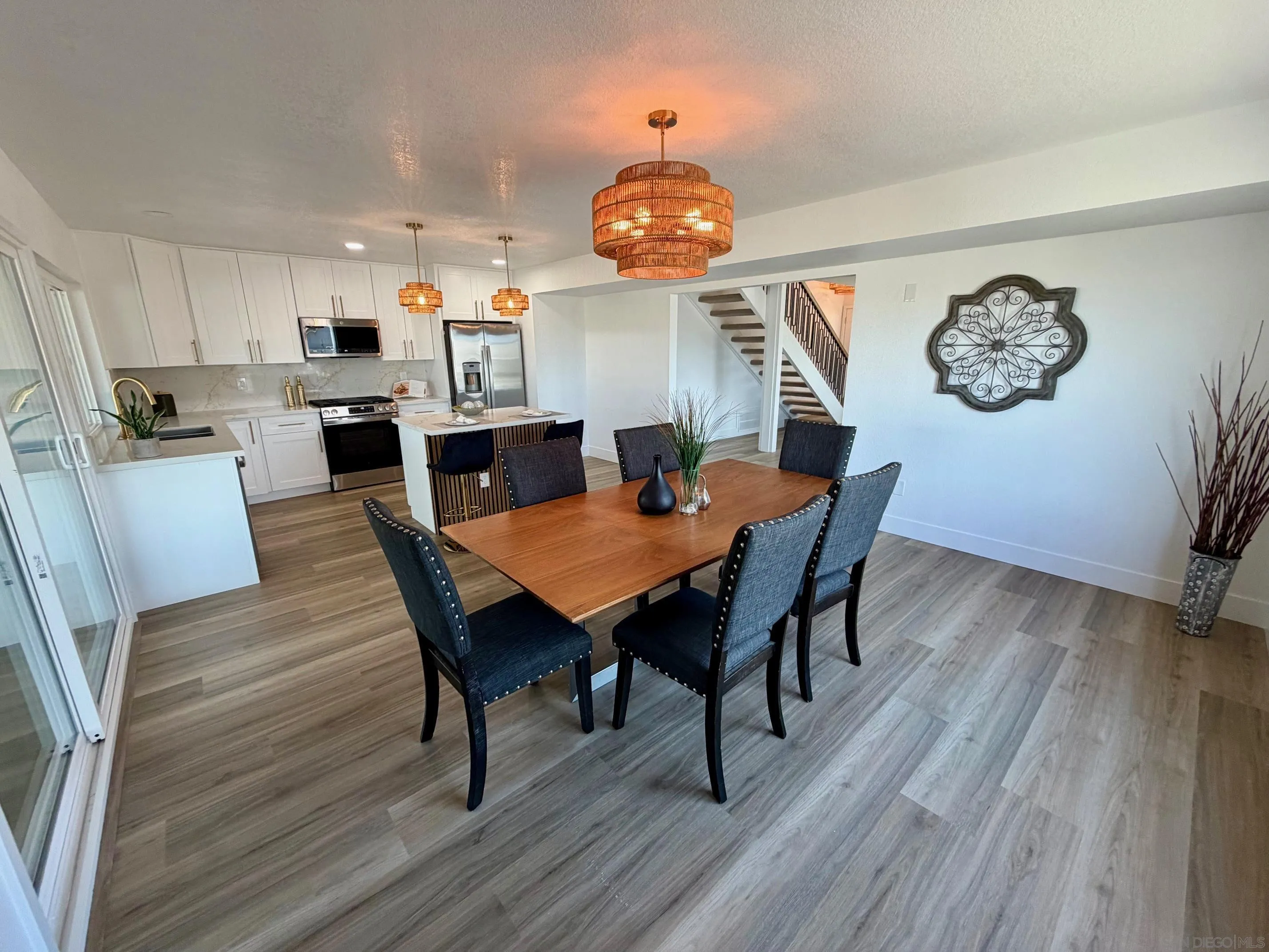 4128 Terry Street Oceanside, CA 92056 - Photo 12 of 21 a dining room with furniture and wooden floor