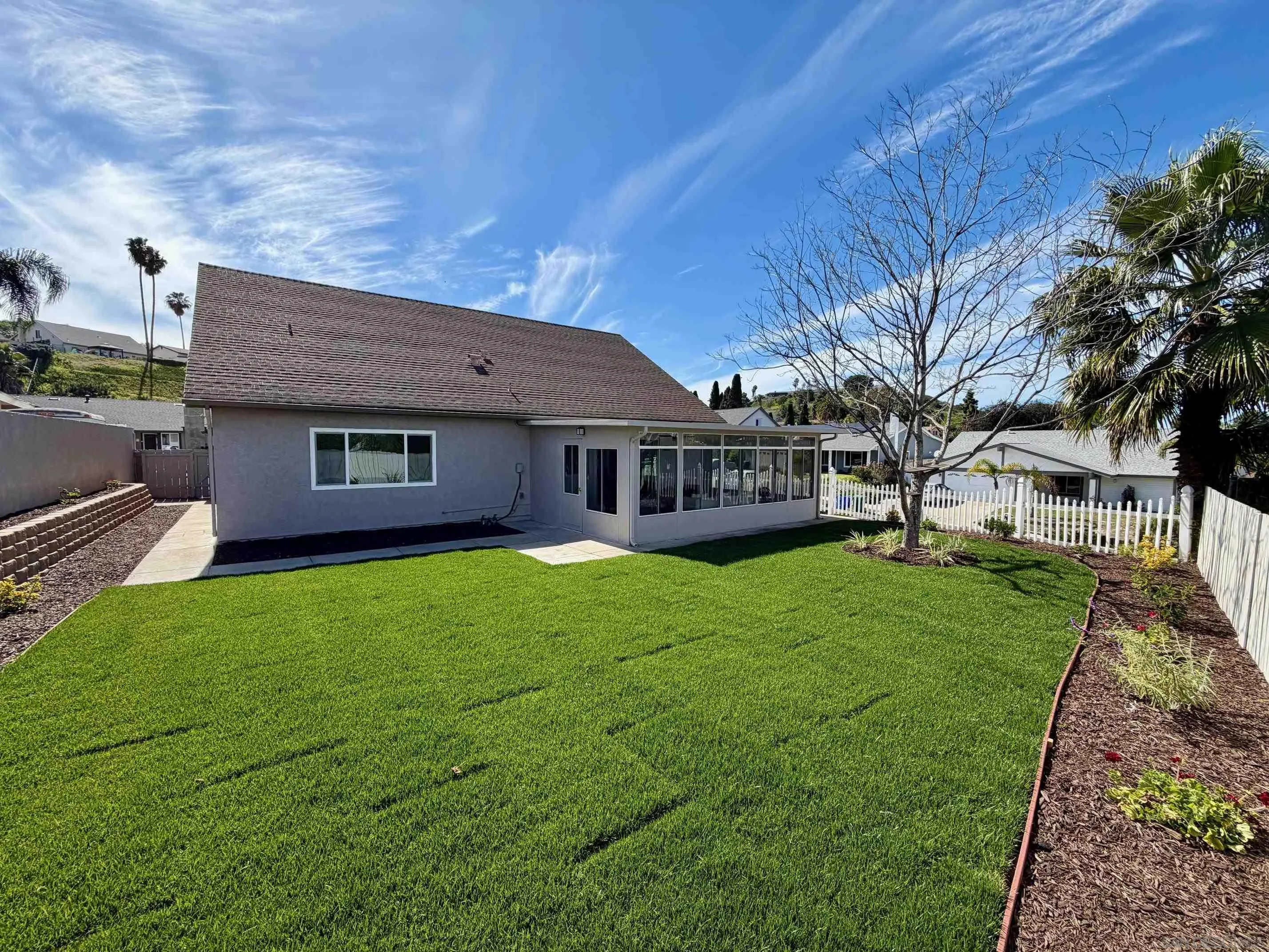 4128 Terry Street Oceanside, CA 92056 - Photo 18 of 21 a front view of a house with a garden